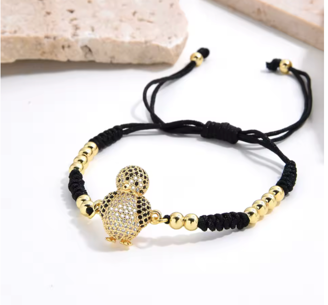 60656884 Pulsera con dije de pingüino en oro laminado 18k (3 Capas)