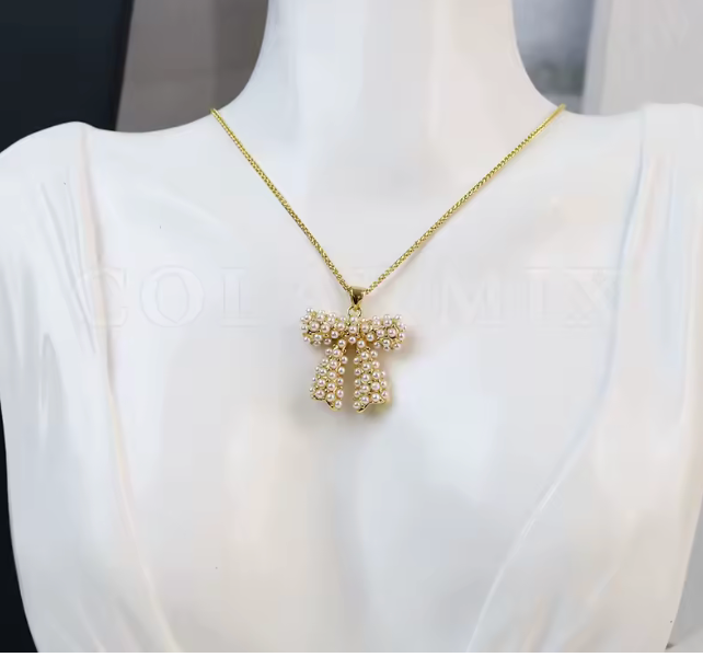 05546228 Conjunto lazos acentuados con perlas en oro laminado 18k (3 Capas)
